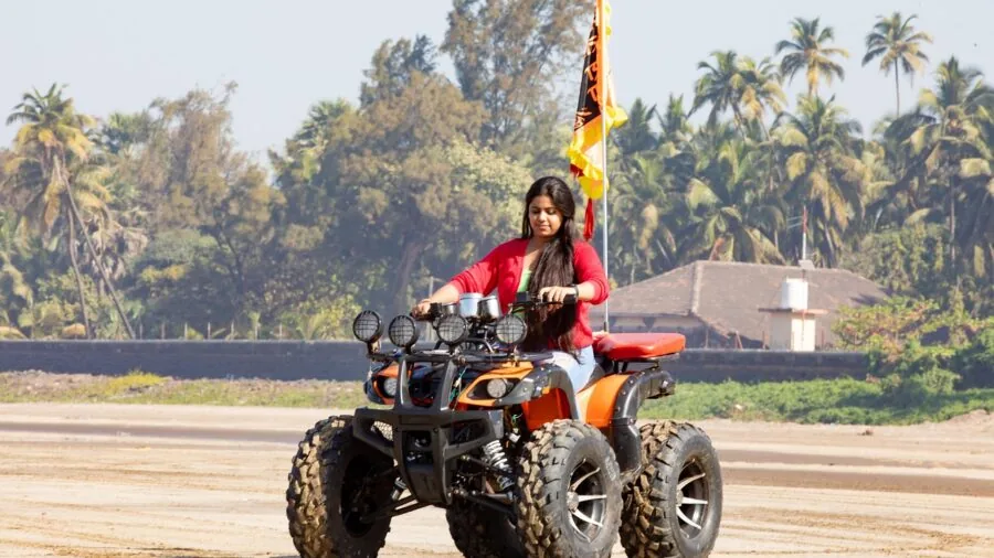 Person riding hoverboard on mixed outdoor terrain demonstrating real-world range and performance