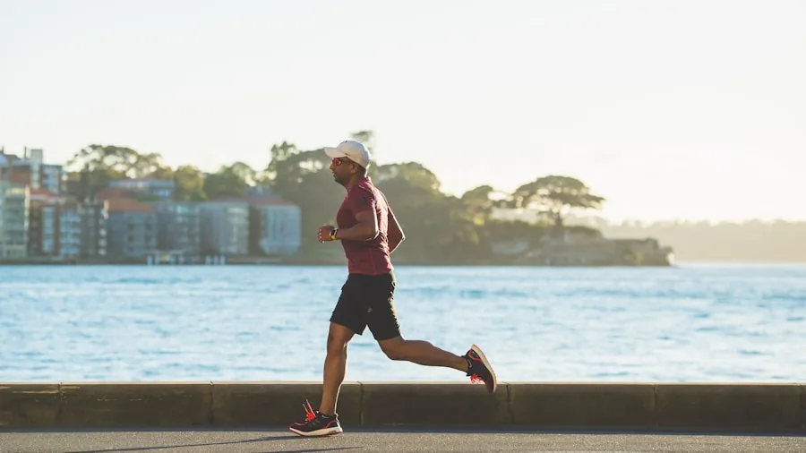 Person running outdoors on a sunny day, wearing athletic gear and enjoying an active lifestyle