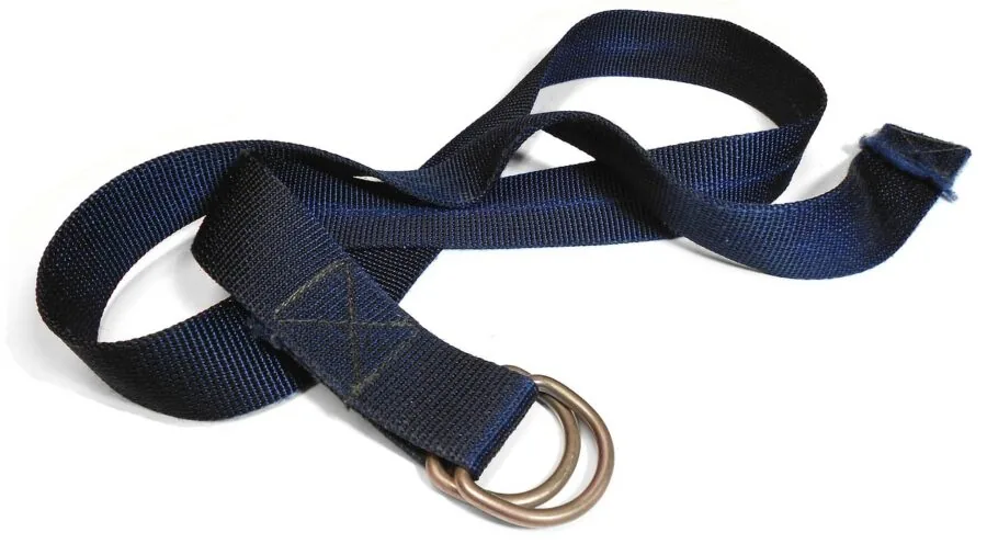 Person securing luggage with durable nylon straps while preparing for travel