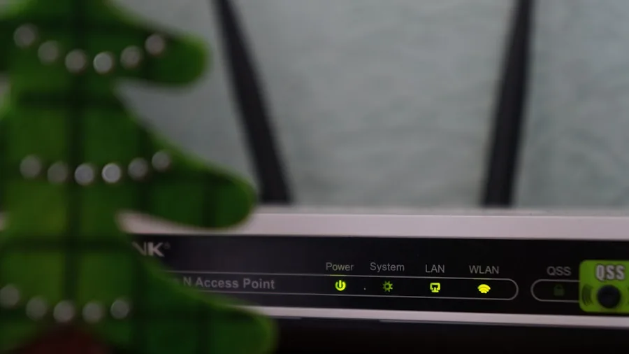 Person setting up wireless home automation technology in contemporary living room