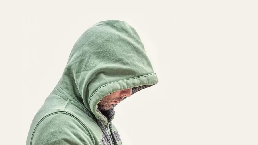 Person sleeping comfortably on breathable bed sheets, appearing cool and relaxed during rest