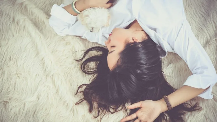 Person sleeping comfortably on pillow, demonstrating quality sleep and fabric contact with skin