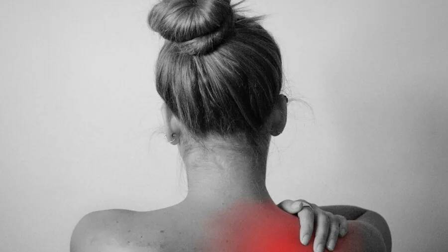 Person sleeping peacefully on back in bed, demonstrating proper spinal alignment and support
