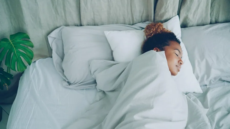 Person sleeping peacefully on bed with breathable white sheets and natural morning light