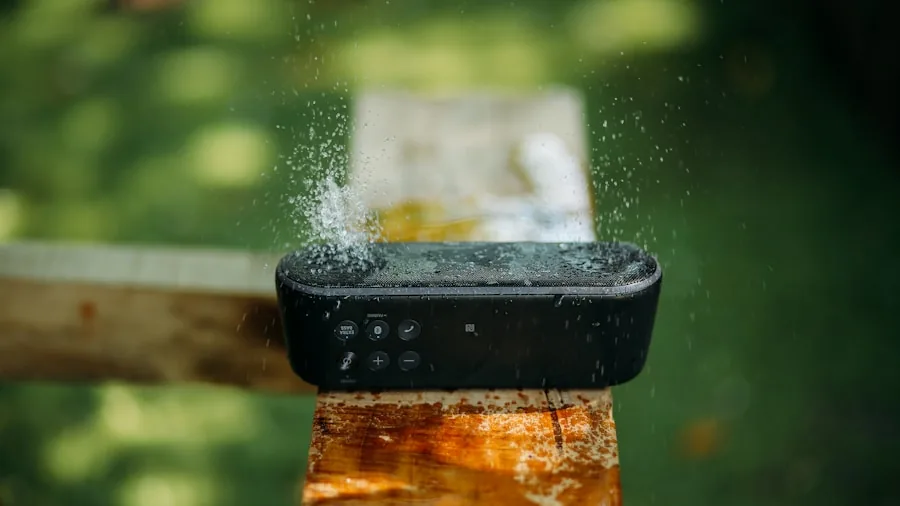 Person testing waterproof speaker durability near water in outdoor lifestyle setting