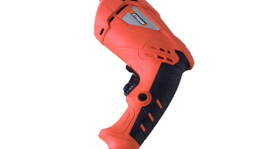 Person using a cordless drill on wooden furniture during a home improvement project
