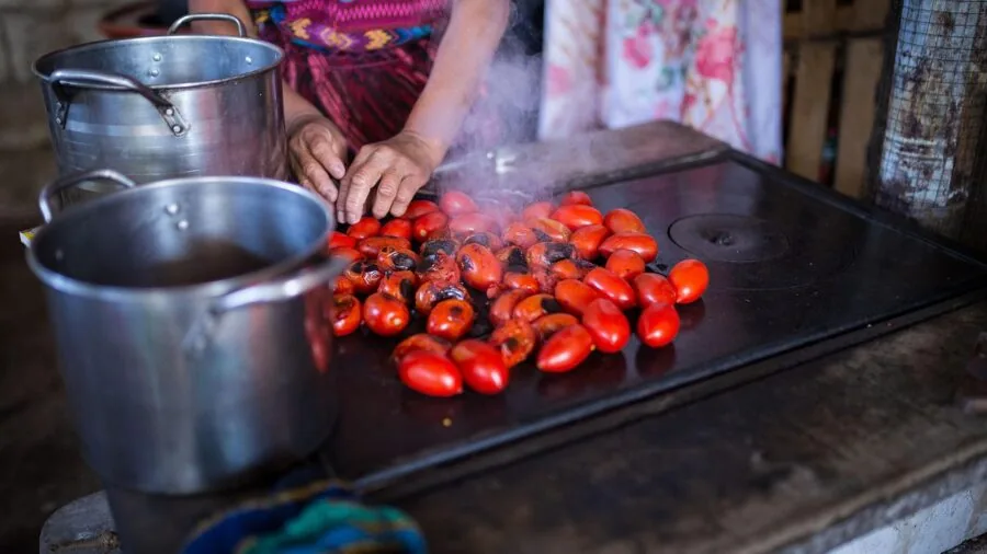 Person using kitchen timer while cooking meal at home countertop
