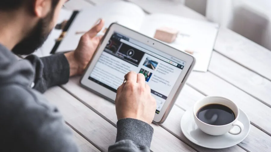 Person using tablet for work and productivity in everyday setting