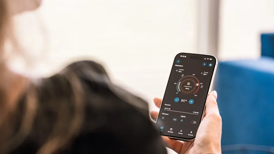 Person using voice commands to control smart home lighting and devices in modern living room