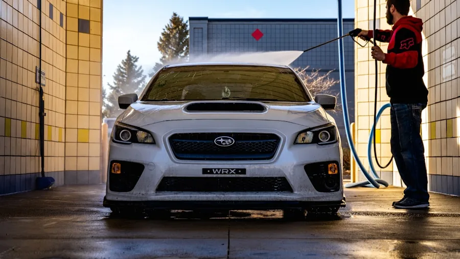 Person washing their car with soap and water, focusing on cost-effective car care routine