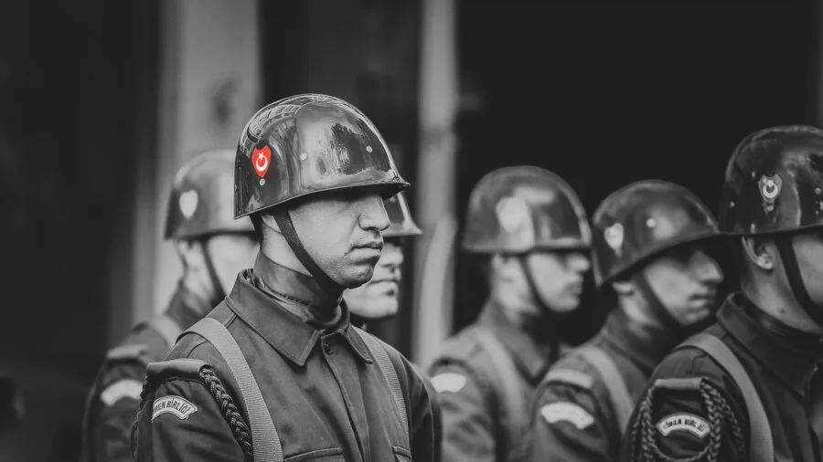 Person wearing adjustable protective headgear, demonstrating comfort and proper fit during extended wear