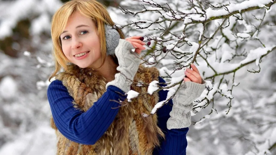 Person wearing cozy earmuffs during winter outdoor activity, showing real-world comfort and warmth in cold weather conditions.