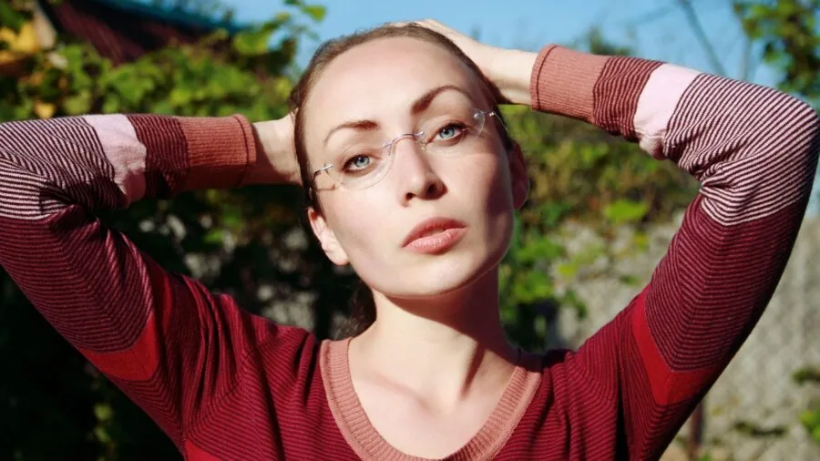 Person wearing glasses throughout daily activities, representing all-day wearability and comfort