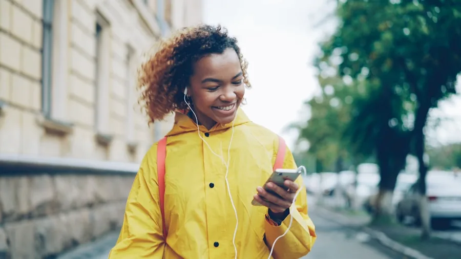 Person wearing headphones outdoors experiencing ambient sound in natural environment