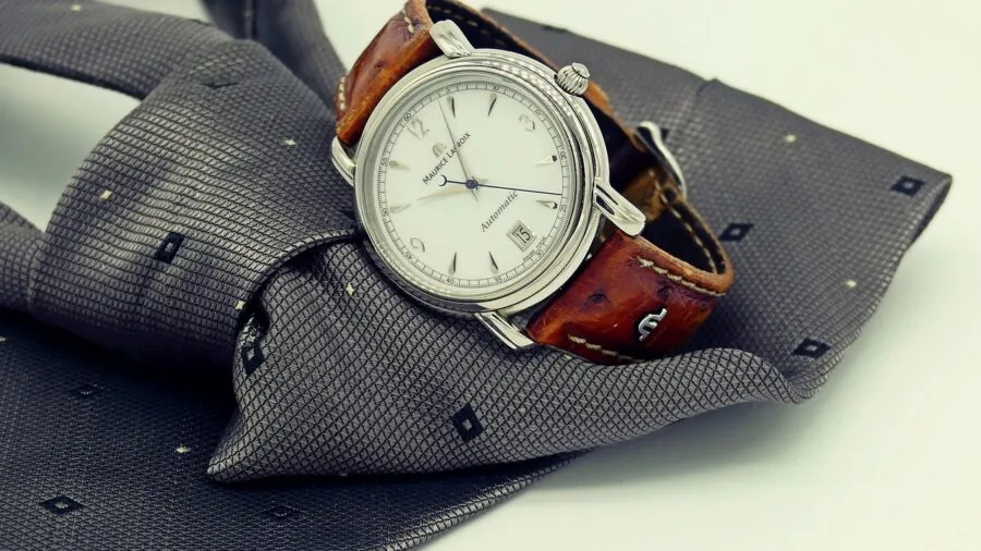 Person wearing large dive watch on wrist during everyday activity