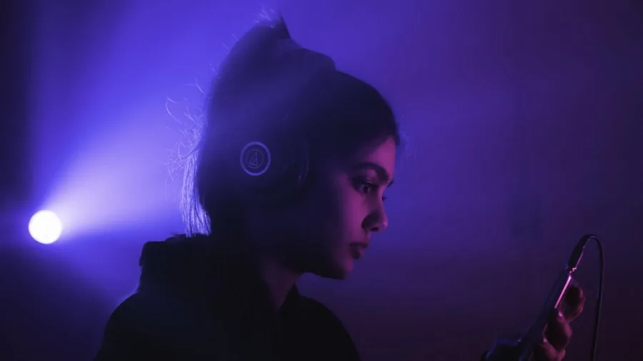 Person wearing over-ear headphones enjoying music in a lifestyle setting