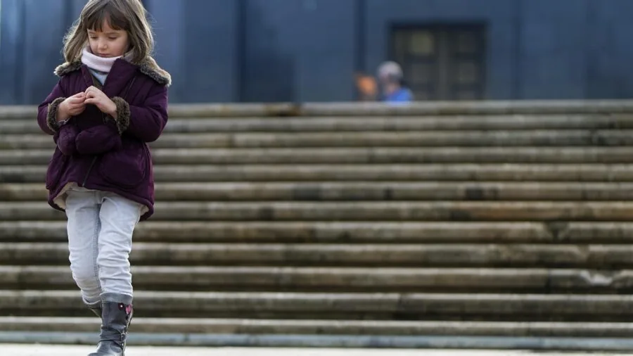 Person wearing sturdy winter gloves while doing outdoor activity in cold weather