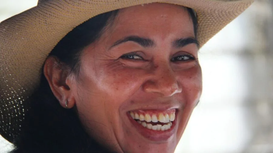 Person with bright white smile and confident expression showcasing dental whitening results