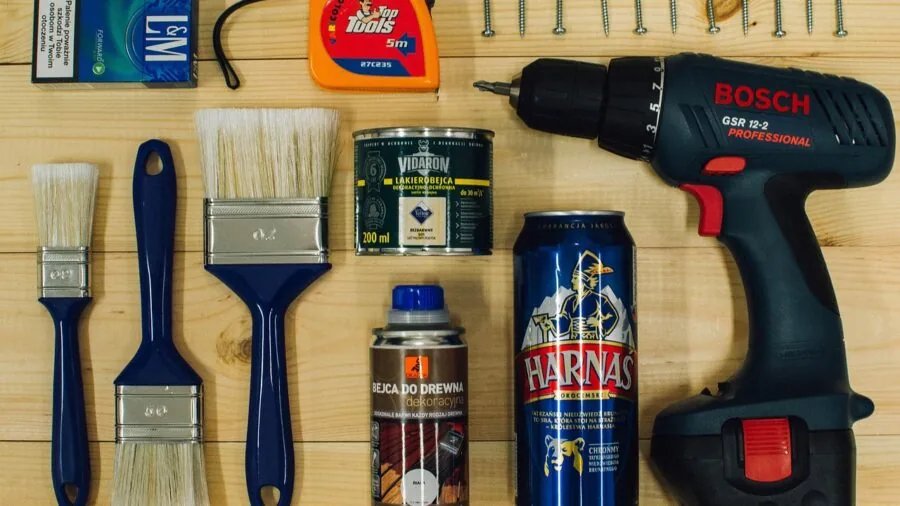 Person working on home improvement project with tools, demonstrating practical DIY work