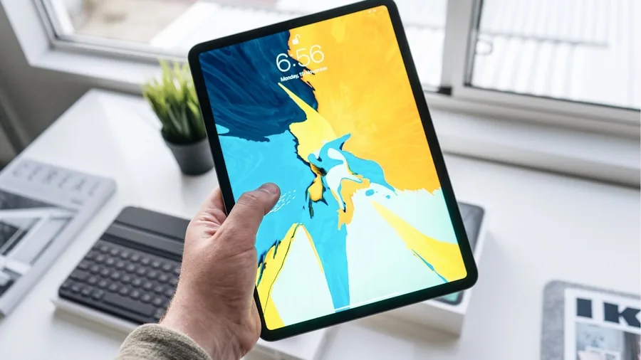 Person working on tablet throughout the day, monitoring battery life and productivity