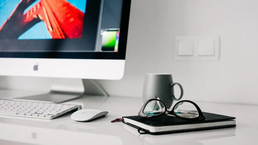 Person working peacefully at home desk during evening hours in a calm, quiet environment
