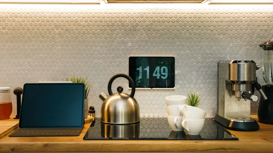 Person's hand touching modern kitchen appliance control panel while preparing meal