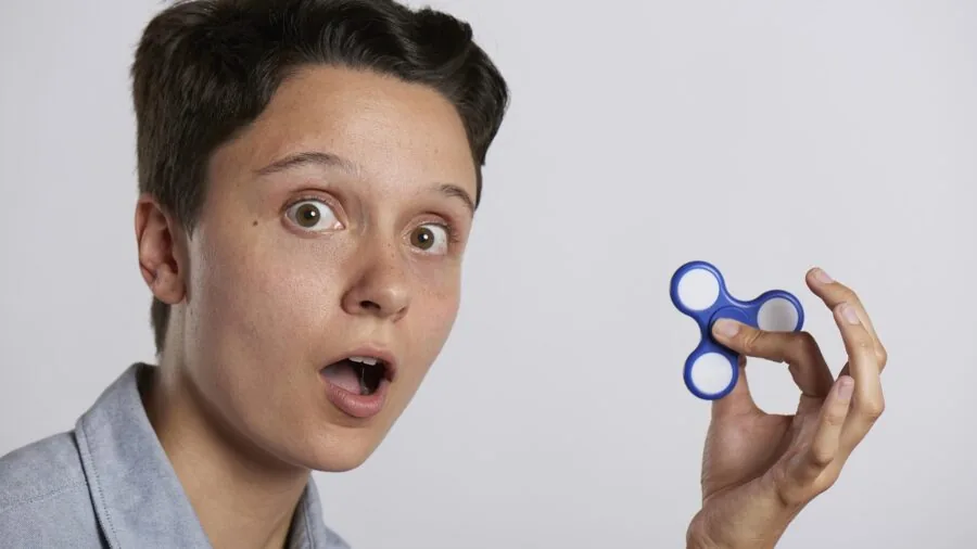 Person's hands engaging with fidget toy, demonstrating tactile sensory input and stress relief play
