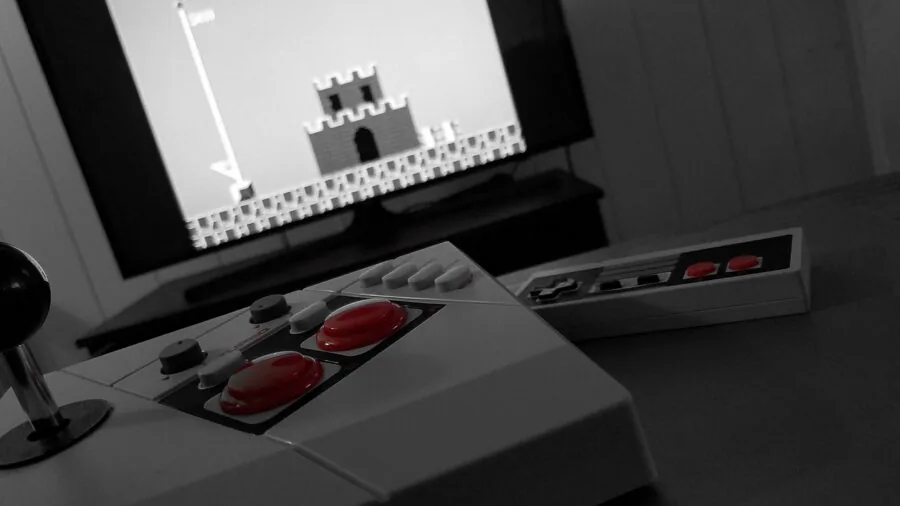 Person's hands gripping gaming controller during intense gameplay with tactile feedback