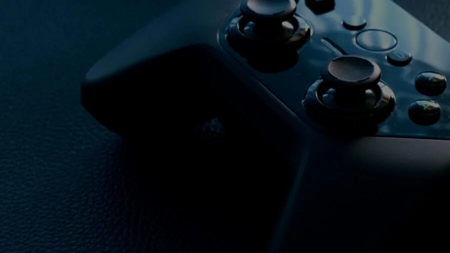 Person's hands holding gaming controller during extended play session, demonstrating comfortable grip and ergonomic positioning