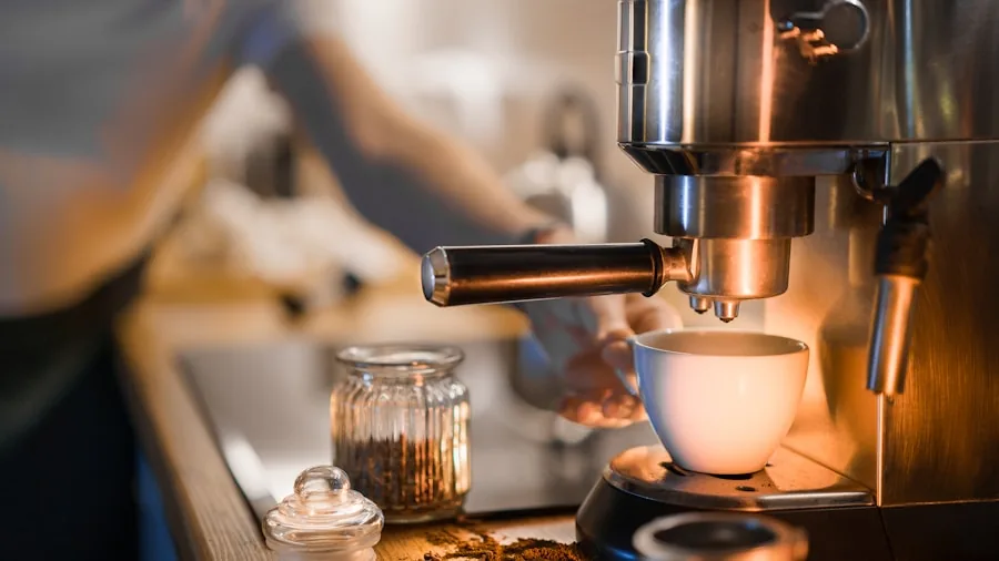 Person's hands operating espresso machine controls and display panel in a home kitchen setting