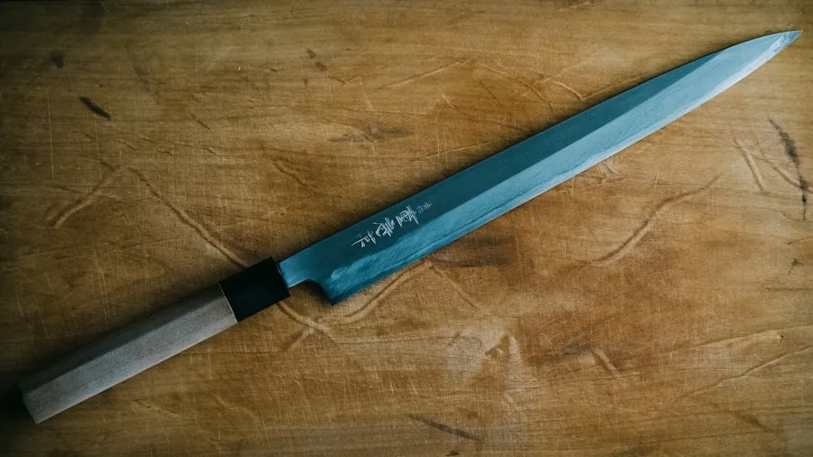 Professional chef maintaining kitchen knife blade sharpness with sharpening steel
