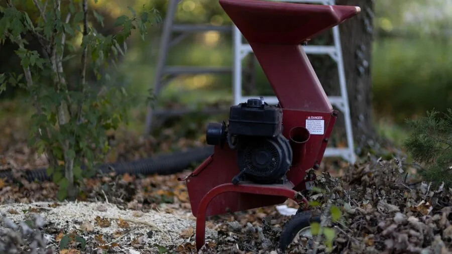 Professional contractor operating heavy-duty power tool on construction project site