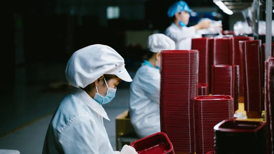 Professional inspecting safety equipment standards in workplace environment