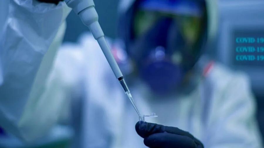 Professional technician inspecting electrical equipment in a modern testing laboratory with safety certification standards