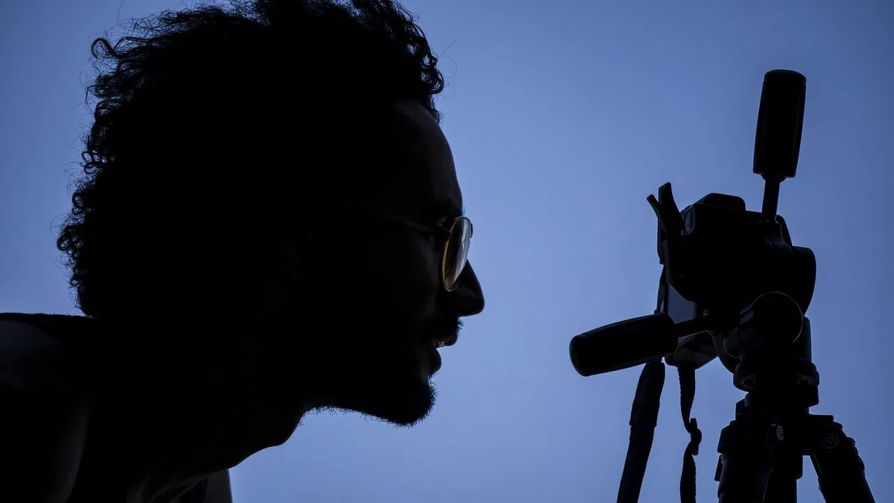 Professional vlogging camera mounted on tripod with microphone attachment for content creation