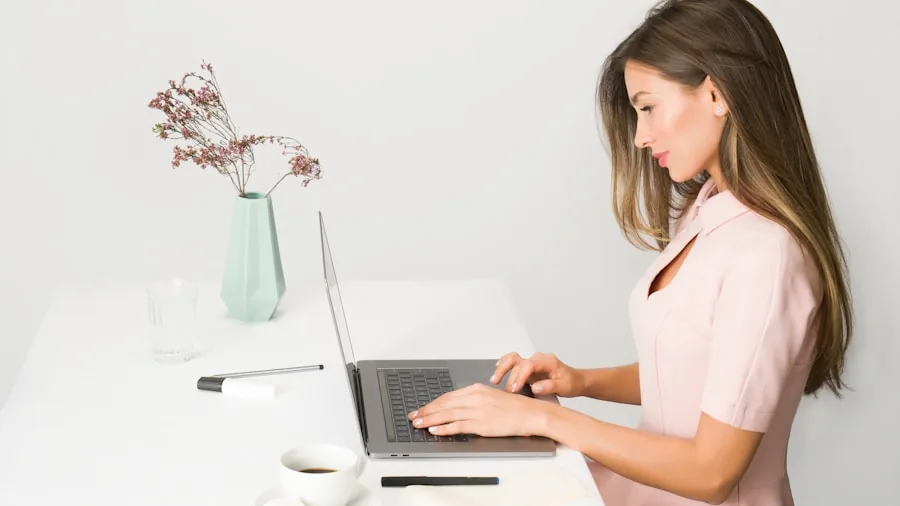 Professional working on multiple creative projects at desk with organized workspace