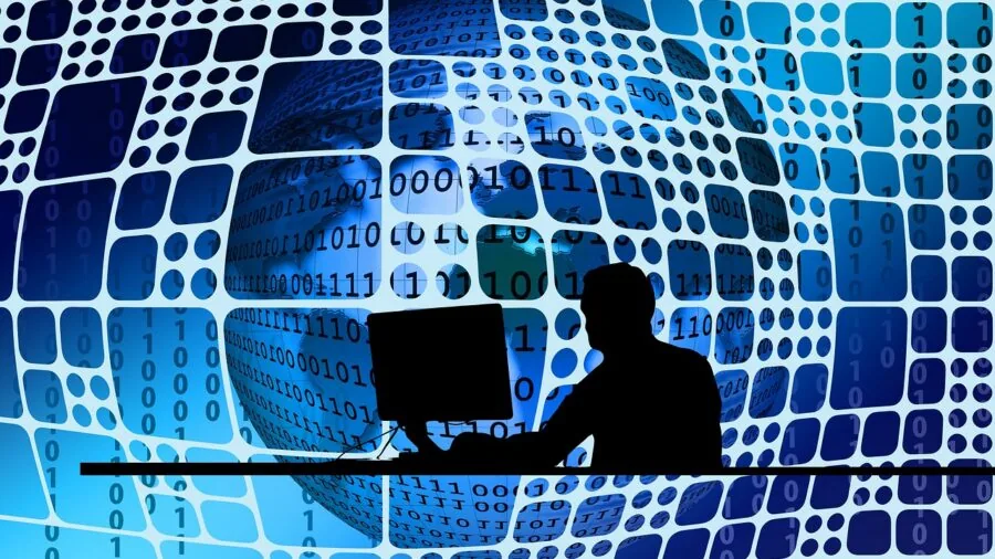 Professional workspace with person using desktop monitor setup for detailed work