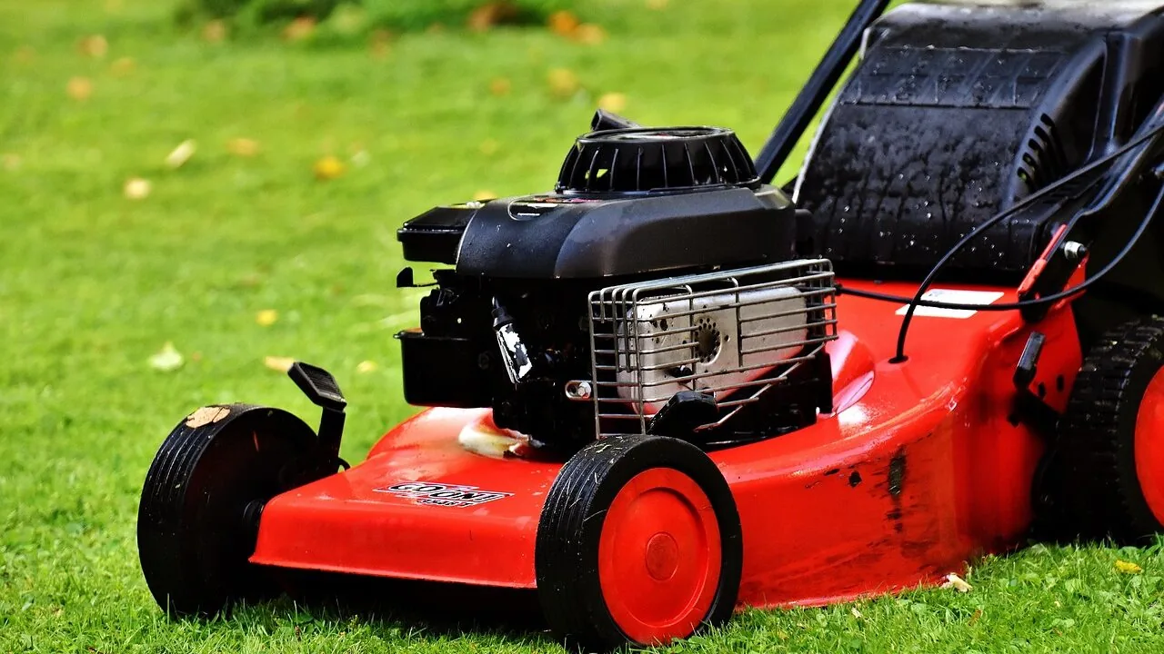 Self propelled lawn mower in action on residential lawn