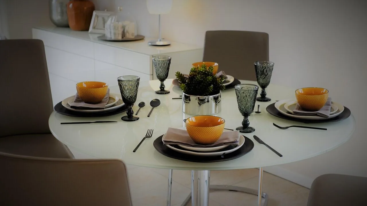 Set of dinner plates arranged on table with natural lighting