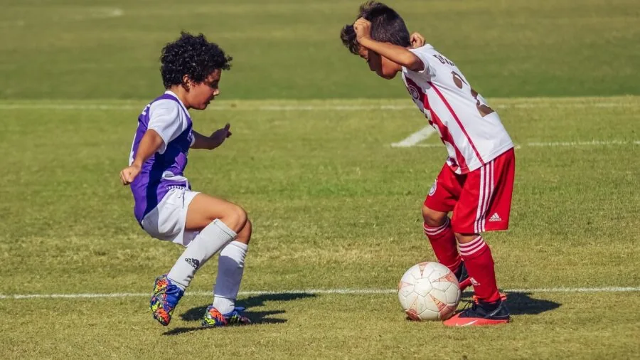 Soccer player in action on grass field during training session