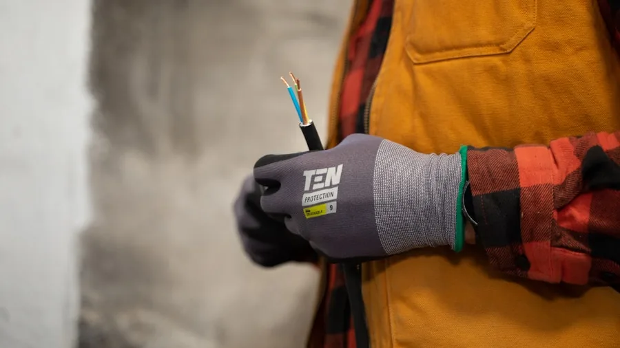 Someone examining different wire gauges and thicknesses for an audio installation project