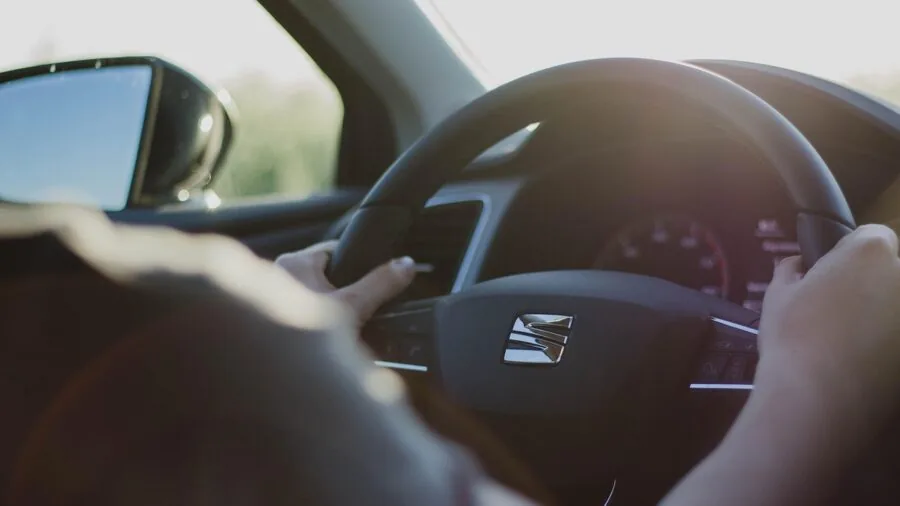 Sunlight streaming through car windows with protective shading, representing vehicle interior safety solutions