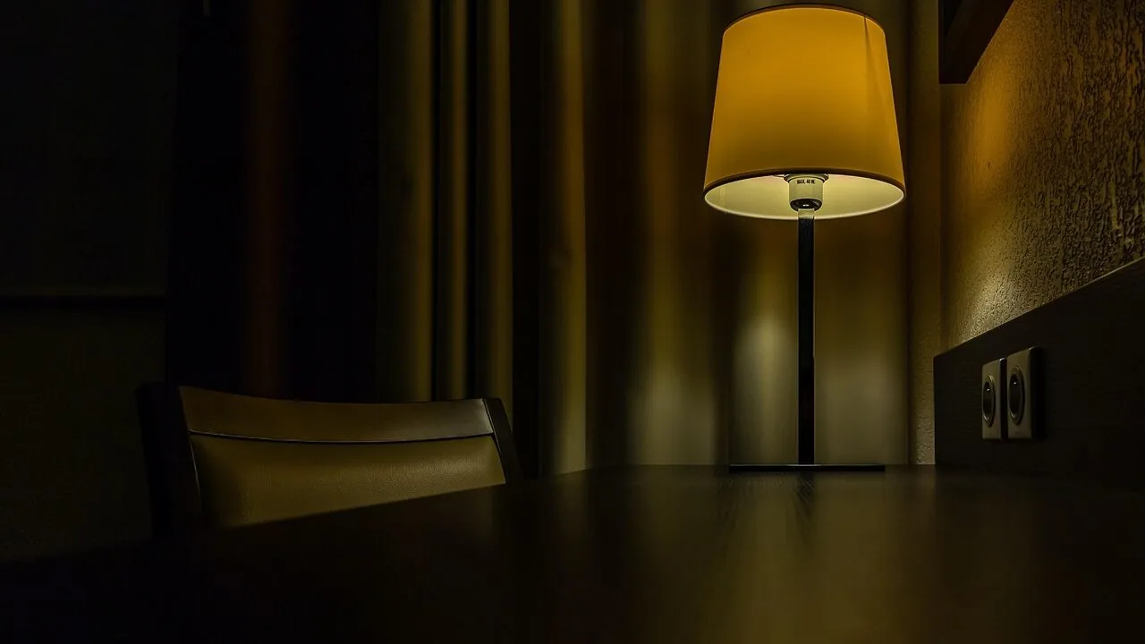 Table lamp illuminating workspace on desk