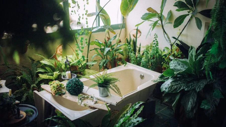 Toddler learning bathroom hygiene habits with parent guidance in bright bathroom setting
