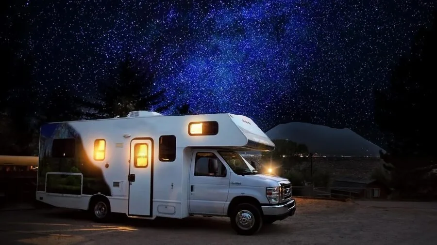 Travel trailer safely parked on level campground with proper stabilization setup