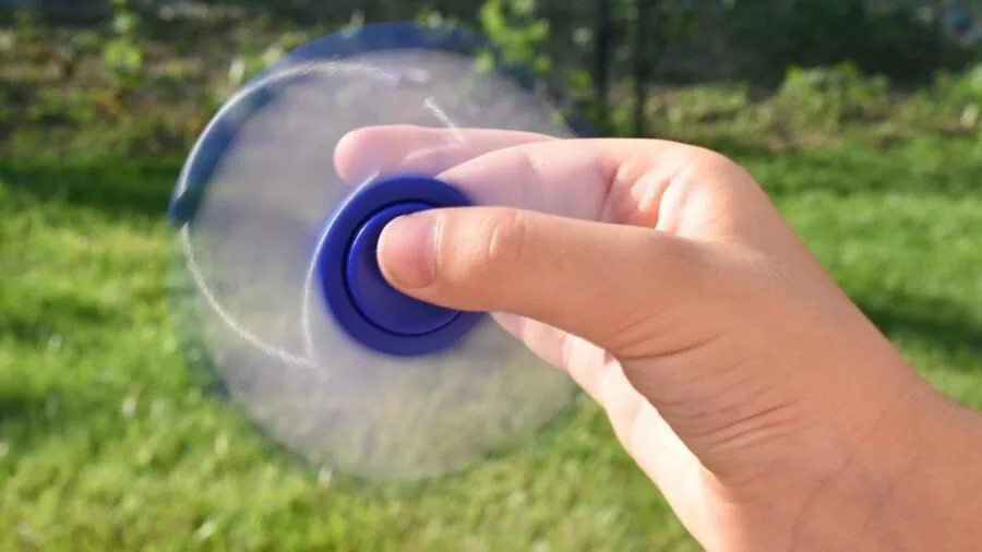Various colorful sensory fidget toys and stress relief tools arranged together on a surface