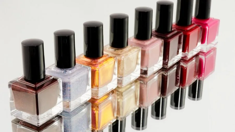 Various nail polish remover formats displayed on a vanity, showing different application methods and packaging styles