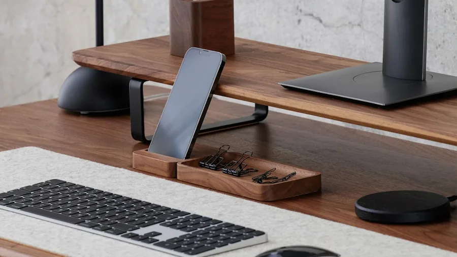 Various phone mounting solutions arranged on a workspace desk showing different stand styles and angles