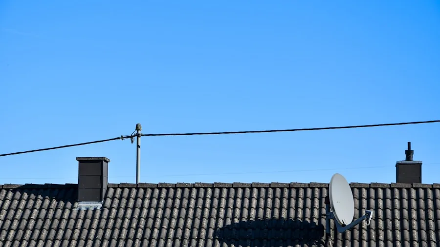 Weathered outdoor antenna mounted on residential roofline exposed to elements