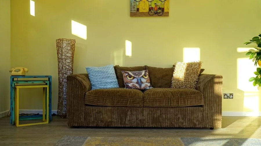 Well-lit modern living room with bright ambient lighting creating a warm, comfortable atmosphere